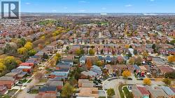 Aerial view of property and surrounding area featuring nearby suburban area - 