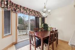 Dining room featuring a chandelier and light wood-style floors - 