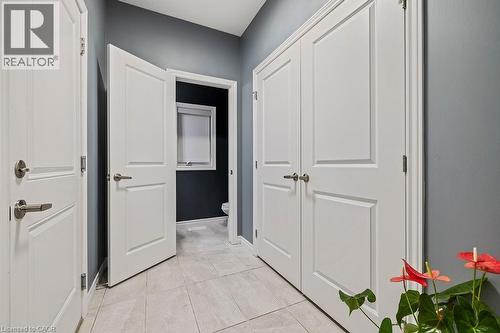 Hallway featuring light tile patterned floors and baseboards - 4040 Stadelbauer Drive, Beamsville, ON - Indoor Photo Showing Other Room