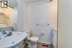 Bathroom featuring independent washer and dryer - 