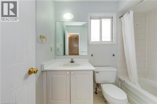 Bathroom featuring vanity, shower / bath combo with shower curtain, and tile patterned floors - 1157 Charminster Crescent, Mississauga, ON - Indoor Photo Showing Bathroom