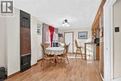 Dining space featuring a heating unit and light wood-type flooring - 