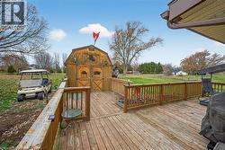 Deck with a yard, grilling area, and a shed - 