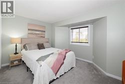 Carpeted bedroom with large bump out window - 