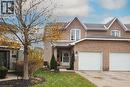 View of front of home featuring brick siding, shingled roof, front lawn, and single car garage - 511 Oakvale Drive Unit# 1, Waterloo, ON  - Outdoor With Facade 