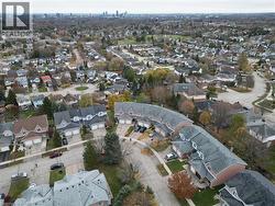Aerial view of property and surrounding area with cityscape in the distance - 
