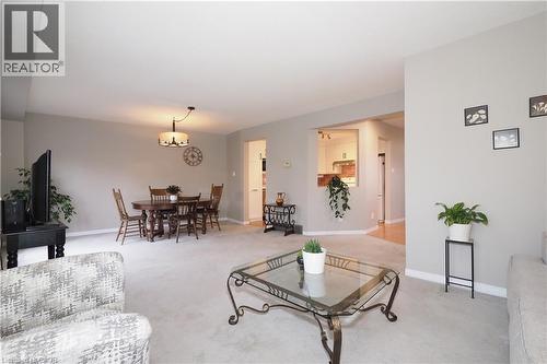 Open concept living/dining area with carpet floors - 511 Oakvale Drive Unit# 1, Waterloo, ON - Indoor Photo Showing Living Room