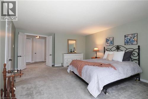 Large primary bedroom with double door entrance - 511 Oakvale Drive Unit# 1, Waterloo, ON - Indoor Photo Showing Bedroom