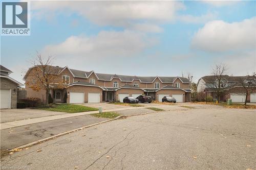 Traditional-style house with a garage and driveway - 511 Oakvale Drive Unit# 1, Waterloo, ON - Outdoor