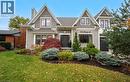 View of front of house featuring a front yard, a chimney, and a shingled roof - 735 George Street, Burlington, ON  - Outdoor With Facade 