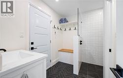 Mudroom featuring a sink - 