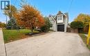 View of front of house featuring driveway and an attached garage - 735 George Street, Burlington, ON  - Outdoor 
