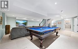 Game room featuring pool table, light colored carpet, and recessed lighting - 