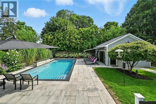 Swimming pool with a patio - 735 George Street, Burlington, ON - Outdoor With In Ground Pool With Deck Patio Veranda