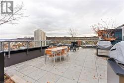 View of patio / terrace featuring grilling area and outdoor dining area - 
