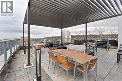 View of patio featuring outdoor dining space and a pergola - 