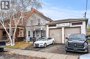 View of front facade featuring asphalt driveway and an attached garage - 246 Mary Street, Hamilton, ON 