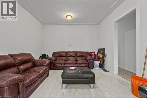 Living area with hardwood / wood-style flooring and a textured ceiling - 246 Mary Street, Hamilton, ON 