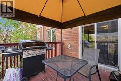 Deck with area for grilling, outdoor dining area, and a gazebo - 