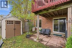 View of patio featuring a storage unit - 