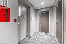 Hallway with baseboards and attic access - 