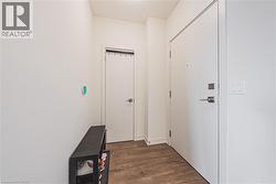 Hall with dark wood-style flooring - 