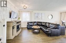 Living room with wood finished floors and baseboards - 