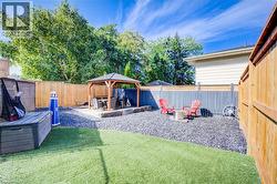 Fenced backyard with a patio and a gazebo - 