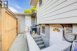 Doorway to property with brick siding - 