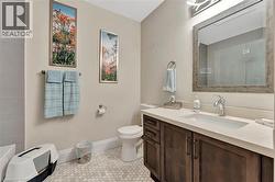 Bathroom featuring vanity and light tile patterned floors - 
