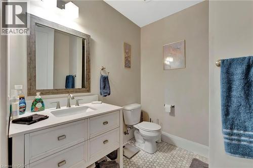 Half bath with vanity and light tile patterned flooring - 85B Morrell Street Unit# 117, Brantford, ON - Indoor Photo Showing Bathroom