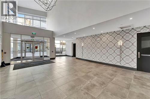 Community lobby featuring recessed lighting and a towering ceiling - 85B Morrell Street Unit# 117, Brantford, ON - Indoor Photo Showing Other Room