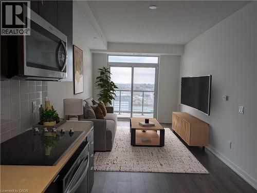 Virtually Staged - 55 Duke Street W Unit# 2106, Kitchener, ON - Indoor Photo Showing Living Room