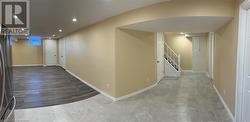 Hallway featuring stairway, recessed lighting, and baseboards - 