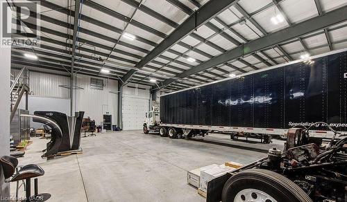Garage with metal wall - 55 Progress Drive E, Aylmer, ON 