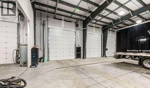 Garage with metal wall - 55 Progress Drive E, Aylmer, ON 