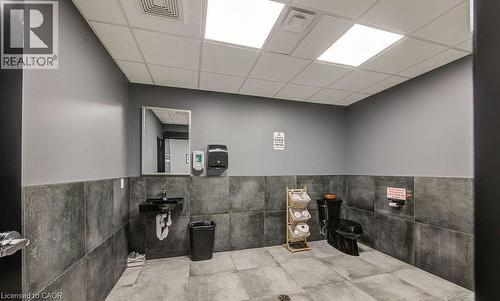 Bathroom with tile walls, a paneled ceiling, and wainscoting - 55 Progress Drive E, Aylmer, ON 