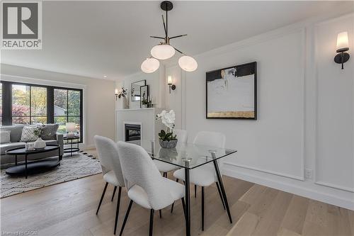 3029 Eva Drive, Burlington, ON - Indoor Photo Showing Dining Room With Fireplace