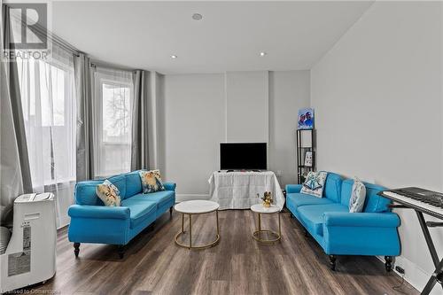Living area featuring recessed lighting and wood finished floors - 181 West Avenue N, Hamilton, ON - Indoor Photo Showing Living Room