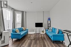 Living area featuring recessed lighting and wood finished floors - 