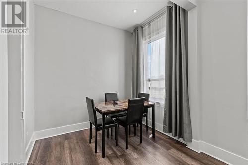 Dining area with dark wood-type flooring and baseboards - 181 West Avenue N, Hamilton, ON - Indoor Photo Showing Dining Room