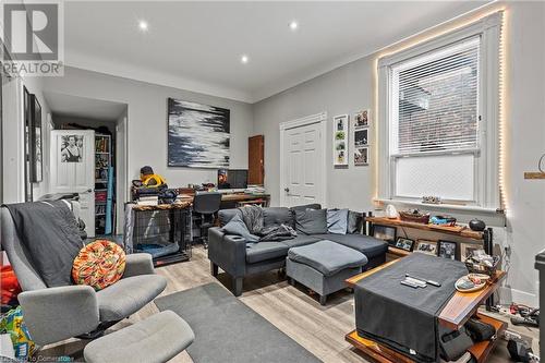 Living area featuring light wood-style floors and recessed lighting - 181 West Avenue N, Hamilton, ON - Indoor Photo Showing Living Room