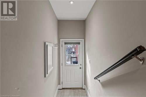 Entryway featuring light tile patterned floors and baseboards - 181 West Avenue N, Hamilton, ON - Indoor Photo Showing Other Room