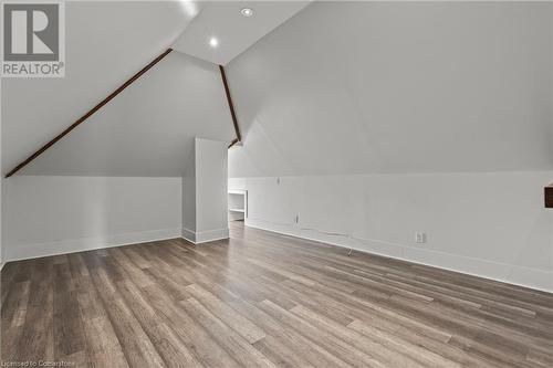 Bonus room featuring recessed lighting, baseboards, lofted ceiling, and wood finished floors - 181 West Avenue N, Hamilton, ON - Indoor Photo Showing Other Room
