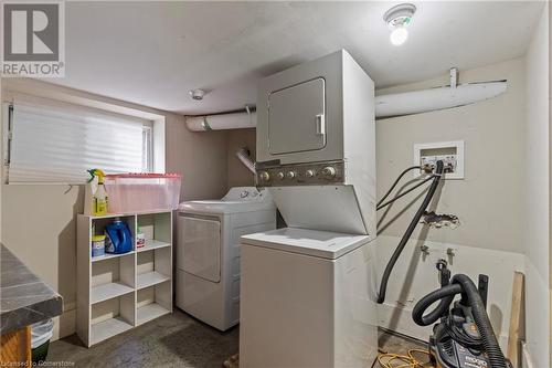 Washroom featuring stacked washer and dryer and laundry area - 181 West Avenue N, Hamilton, ON - Indoor Photo Showing Laundry Room
