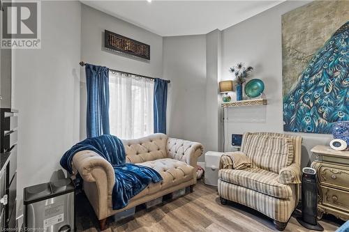 Living area featuring wood finished floors - 181 West Avenue N, Hamilton, ON - Indoor