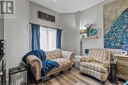 Living area featuring wood finished floors - 