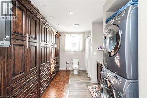 Beautiful custom built clothes cabinets in main floor primary bedroom - 199 Kimberly Drive, Hamilton, ON - Indoor Photo Showing Laundry Room