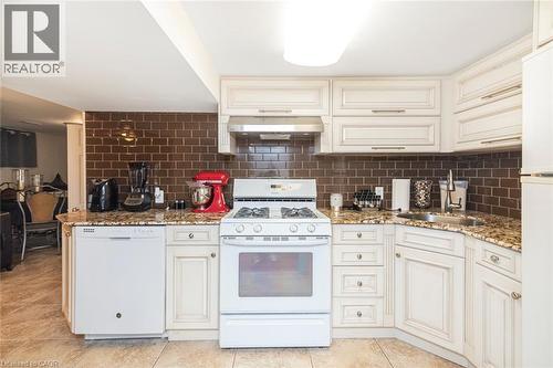 Lower level kitchen with granite counter top and five appliances - 199 Kimberly Drive, Hamilton, ON - Indoor Photo Showing Kitchen