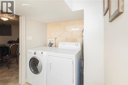 Lower level laundry inside four piece bathroom and wash basin - 199 Kimberly Drive, Hamilton, ON - Indoor Photo Showing Laundry Room